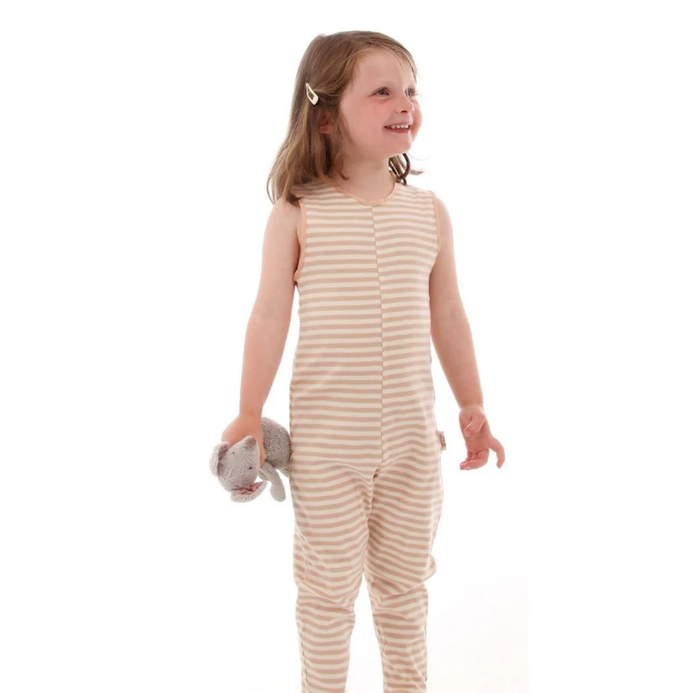 A child wears footless dungarees in cappuccino striped colour